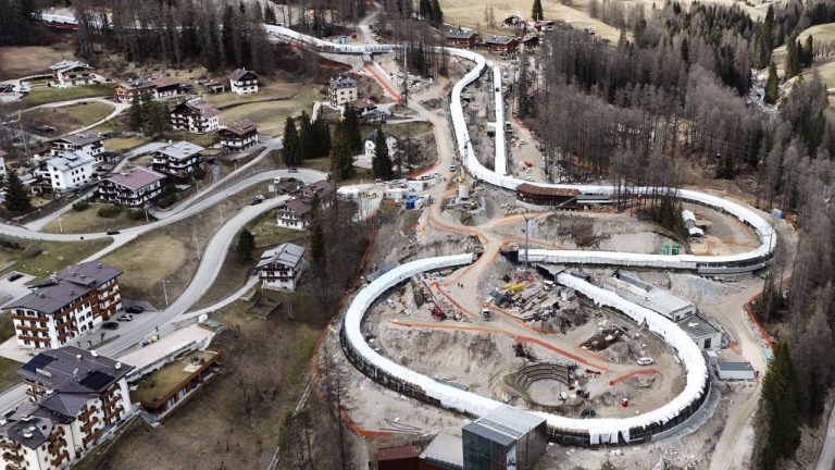 Construction work takes place at the Cortina Sliding Center, venue for the bob, luge and skeleton disciplines at the Milan Cortina 2026 Winter Olympics, in Cortina D'Ampezzo, Italy, Tuesday, March 25, 2025. (AP/Luca Bruno)