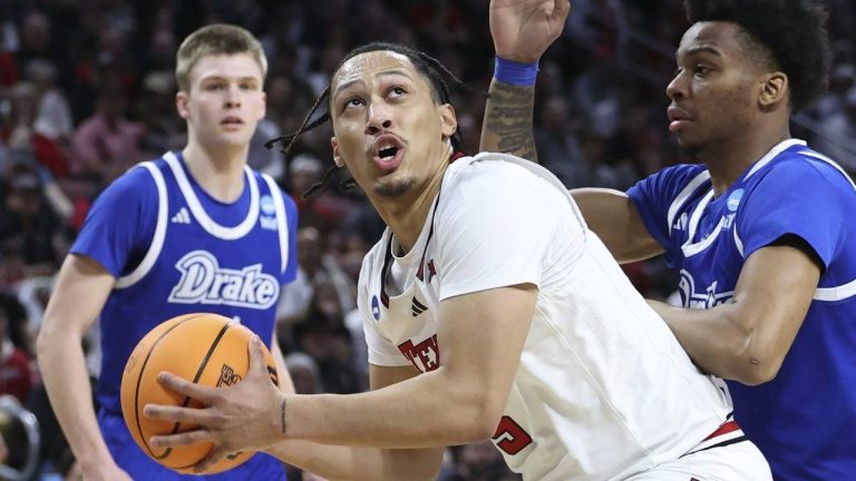 Texas Tech forward Darrion Williams (5) looks for a path to the basket against Drake guard Tavion Banks, right, during the first half in the second round of the NCAA college basketball tournament, Saturday, March 22, 2025, in Wichita, Kan. (Travis Heying/AP)