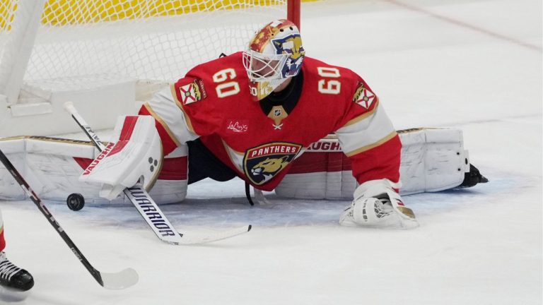 Florida Panthers goaltender Chris Driedger (60) stops a shot by Carolina Hurricanes forward Skyler Brind'Amour (77) during the second period of a preseason NHL hockey game, Saturday, Sept. 28, 2024, in Sunrise, Fla. (Marta Lavandier/AP)
