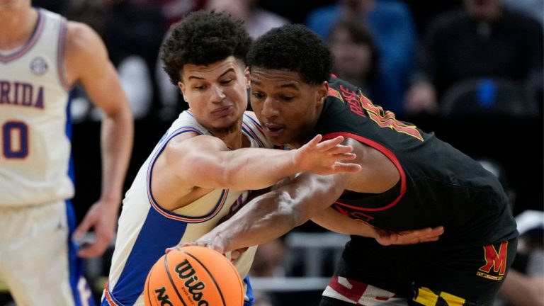 Florida guard Walter Clayton Jr. (1) and Maryland guard Rodney Rice (1) reach for a loose ball during the first half in the Sweet 16 of the NCAA college basketball tournament, Thursday, March 27, 2025, in San Francisco. (Godofredo A. Vásquez/AP)