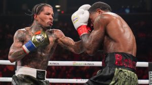 Gervonta Davis, left, punches Lamont Roach during the sixth round of a WBA lightweight championship boxing bout Sunday, March 2, 2025, in New York. (AP Photo/Frank Franklin II)