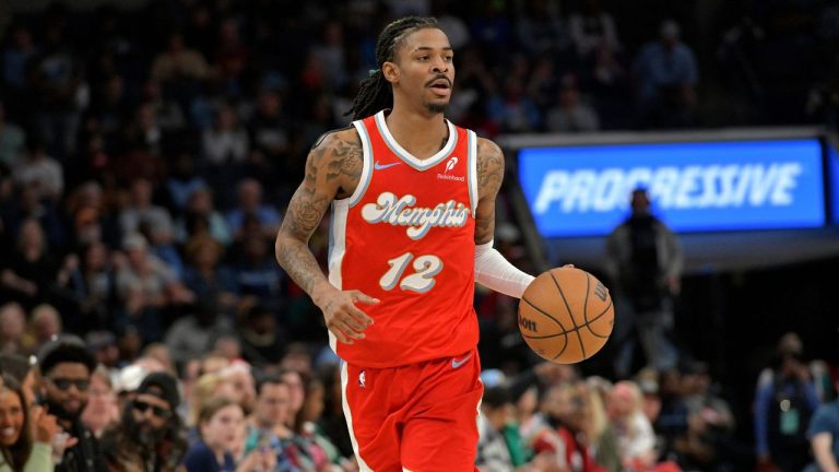 Memphis Grizzlies guard Ja Morant (12) brings the ball up court in the second half of an NBA basketball game against the Cleveland Cavaliers Friday, March 14, 2025, in Memphis, Tenn. (Brandon Dill/AP)