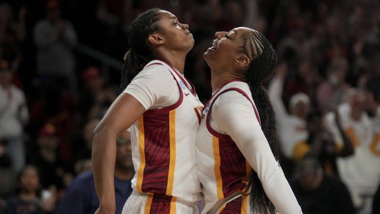 Southern California guard JuJu Watkins (12) drives against UNC Greensboro guard Nya Smith (22) during the first half in the first round of the NCAA college basketball tournament. (Eric Thayer/AP)
