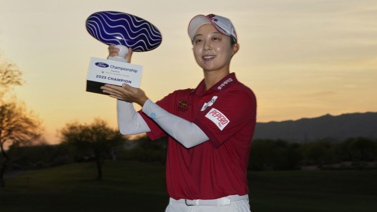 Hyo Joo Kim, of South Korea, holds the champions trophy after the final round of the Ford Championship LPGA golf event, Sunday, March 30, 2025, in Chandler, Ariz. (Matt York/AP)
