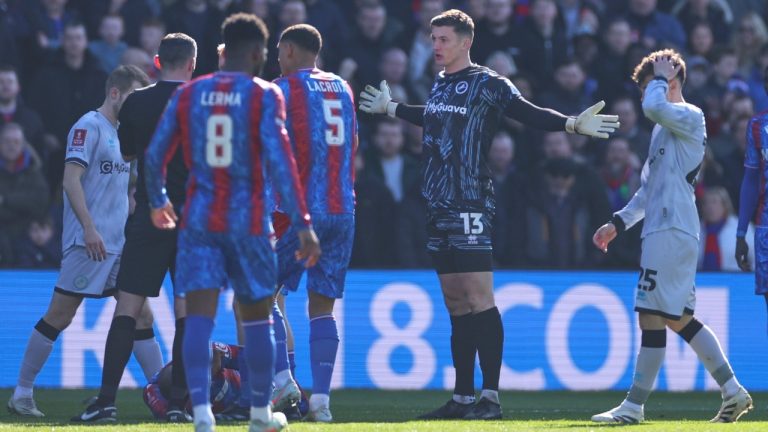 Millwall goalkeeper Liam Roberts reacts before getting a red card for a challenge of Crystal Palace's Jean-Philippe Mateta during the English FA Cup soccer match between Crystal Palace and Millwall at Selhurst Park, London, England, Saturday, March 1, 2025. (AP Photo/Ian Walton)