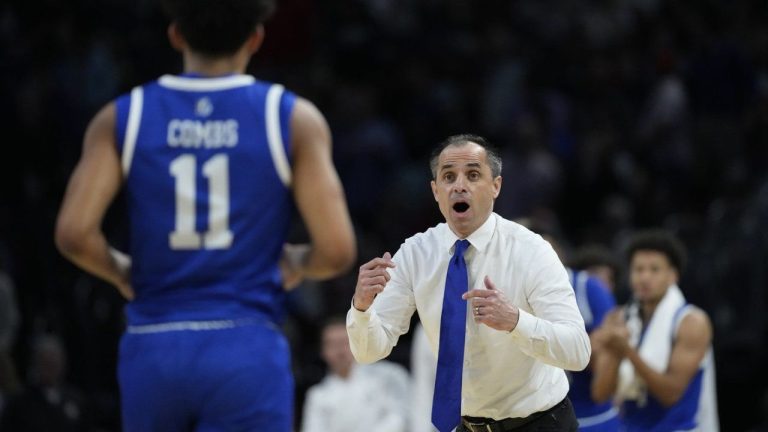 Drake head coach Ben McCollum talks to guard Kael Combs (11) during the second half against Texas Tech in the second round of the NCAA college basketball tournament, Saturday, March 22, 2025, in Wichita, Kan. (Charlie Riedel/AP)