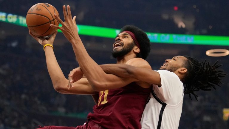 Cleveland Cavaliers center Jarrett Allen (31) is fouled by Brooklyn Nets forward Ziaire Williams, right, in the first half of an NBA basketball game Tuesday, March 11, 2025, in Cleveland. (AP Photo/Sue Ogrocki)