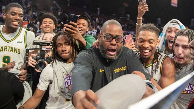 Norfolk State head coach Robert Jones places the team's sticker onto a March Madness ticket after defeating South Carolina State in an NCAA college basketball game in the championship of the Mid-Eastern Athletic Conference tournament, Saturday, March 15, 2025, in Norfolk, Va. (Mike Caudill/AP)