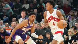 Toronto Raptors forward Scottie Barnes (4) brings the ball upcourt against Phoenix Suns forward Ryan Dunn (0) during the first half of an NBA basketball game in Phoenix, Monday, March 17, 2025. (Darryl Webb/CP)