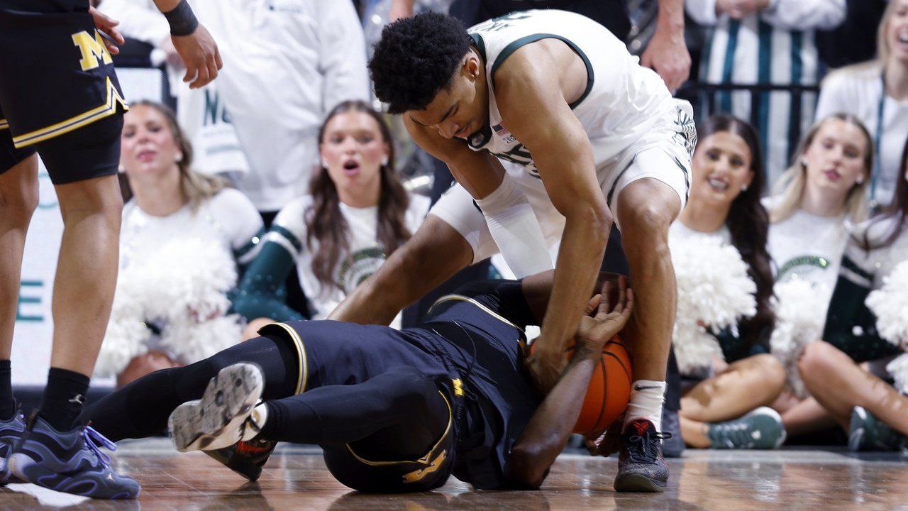 Scuffle Def Michigan and Michigan State players scuffle at centre court late in ...