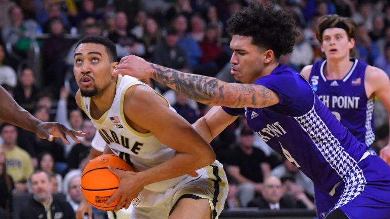 Purdue forward Trey Kaufman-Renn, left, drives to the basket against High Point guard D'Maurian Williams, right, during the second half in the first round of the NCAA college basketball tournament, Thursday, March 20, 2025, in Providence, R.I. (Steven Senne/AP)