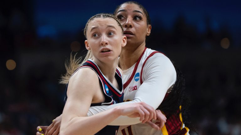 UConn guard Paige Bueckers, left, and Southern California guard Kennedy Smith watch for the ball during the second half in the Elite Eight of the NCAA college basketball tournament Monday, March 31, 2025, in Spokane, Wash. (Jenny Kane/AP)