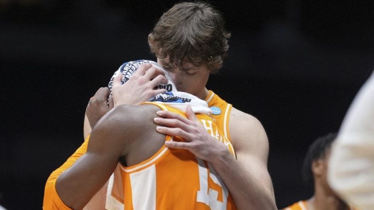 Tennessee's Jahmai Mashack, front, gets a hug from teammate Cade Phillips after losing to Houston in the Elite Eight round of the NCAA college basketball tournament Sunday, March 30, 2025, in Indianapolis. (Michael Conroy/AP)