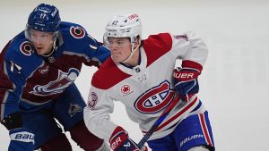 Montreal Canadiens right wing Cole Caufield (13) and Colorado Avalanche centre Parker Kelly (17) in the second period of an NHL hockey game Saturday, Jan. 4, 2025, in Denver. (David Zalubowski/AP)