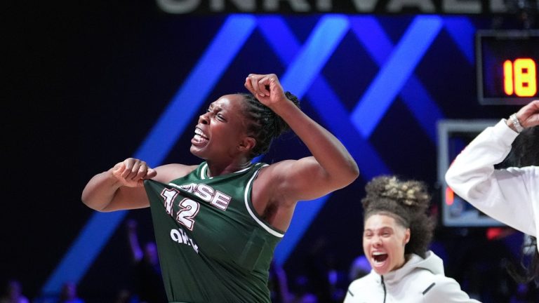 Rose guard Chelsea Gray (12) celebrates with teammates after scoring the game-winning basket against the Laces in their Unrivaled 3-on-3 basketball semifinal, Sunday, March 16, 2025, in Medley, Fla. (Rebecca Blackwell/AP)