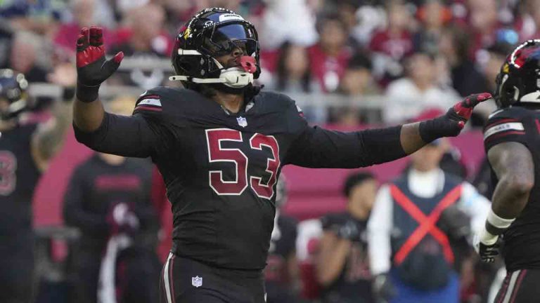 Arizona Cardinals linebacker Baron Browning (53) raises his arms during the first half of an NFL football game against the Seattle Seahawks, Dec. 8, 2024, in Glendale, Ariz. (Rick Scuteri/AP)