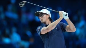 Rickie Fowler of New York Golf Club watches a shot on the tenth hole during the inaugural match of the TMRW Golf League, against The Bay Golf Club, Tuesday, Jan. 7, 2025, in Palm Beach Gardens, Fla. TGL features six teams of four players competing against each other in a tech-infused arena the size of a football field. (Rebecca Blackwell/AP)