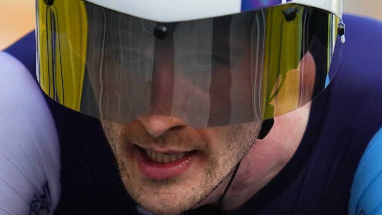 Canada's Derek Gee crosses the finish line of the twenty-first stage of the Tour de France cycling race, an individual time trial over 33.7 kilometers (20.9 miles) with start in Monaco and finish in Nice, France, Sunday, July 21, 2024. (Daniel Cole/AP)