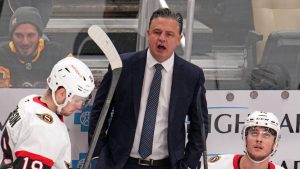 Ottawa Senators head coach Travis Green, centre, gives instructions during the first period of an NHL hockey game against the Pittsburgh Penguins in Pittsburgh, Saturday, Jan. 11, 2025. (Gene J. Puskar/AP)