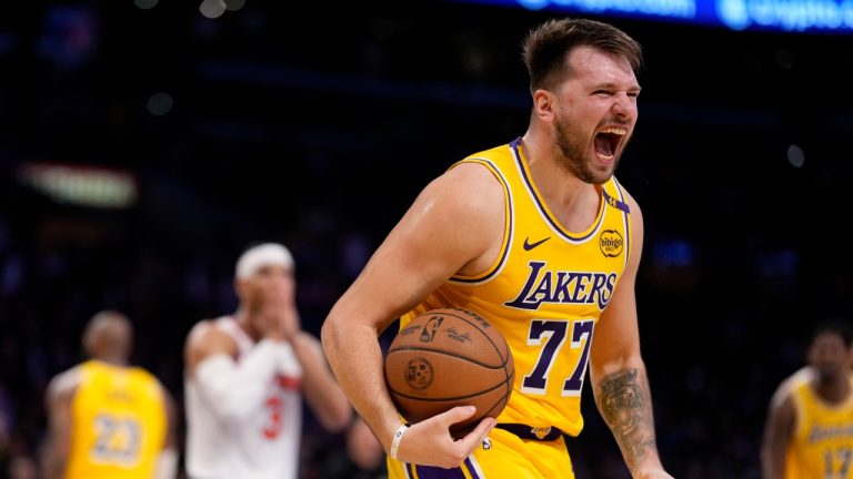 Los Angeles Lakers guard Luka Doncic, right, reacts along with New York Knicks guard Josh Hart after the Knicks turned over the ball during the second half of an NBA basketball game Thursday, March 6, 2025, in Los Angeles. (Mark J. Terrill/AP)