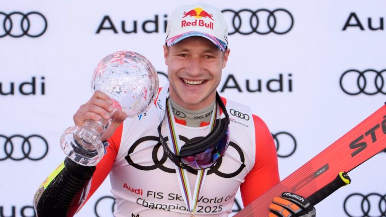 Switzerland's Marco Odermatt poses with his trophy after winning the giant slalom season championship at the World Cup Finals Wednesday, March 26, 2025, in Sun Valley, Idaho. (John Locher/AP)