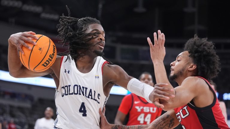 Robert Morris guard Josh Omojafo (4) holds off Youngstown State guard Jason Nelson (0) in the first half of an NCAA college basketball game in the championship of the Horizon League tournament in Indianapolis, Tuesday, March 11, 2025. (Michael Conroy/AP Photo)