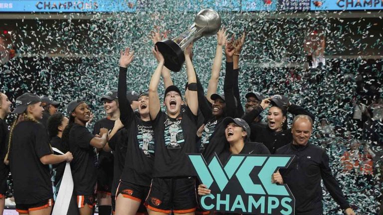 Oregon State players celebrate after defeating Portland in an NCAA college basketball game in the final of the West Coast Conference women's tournament. (John Locher/AP)
