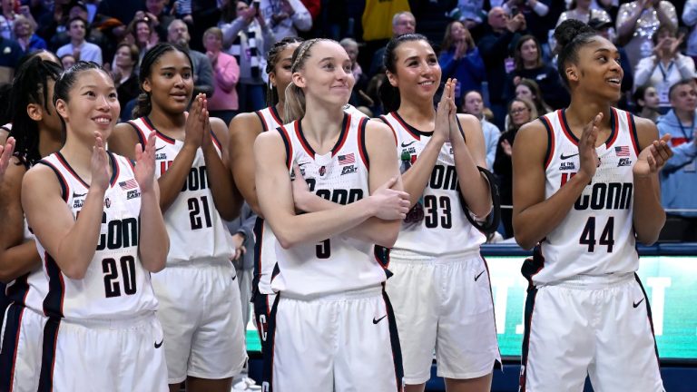 UConn's Paige Bueckers, centre, reacts as her number is revealed on the Huskies of Honor Wall during senior day ceremonies after an NCAA college basketball game against Marquette, Sunday, March 2, 2025, in Storrs, Conn. (Jessica Hill/AP)