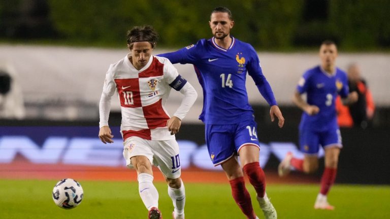 Croatia's Luka Modric challenges for the ball with France's Adrien Rabiot during the UEFA Nations League quarterfinal soccer match between Croatia and France, at the Poljud stadium in Split, Croatia, Thursday, March 20, 2025. (Darko Bandic/AP)