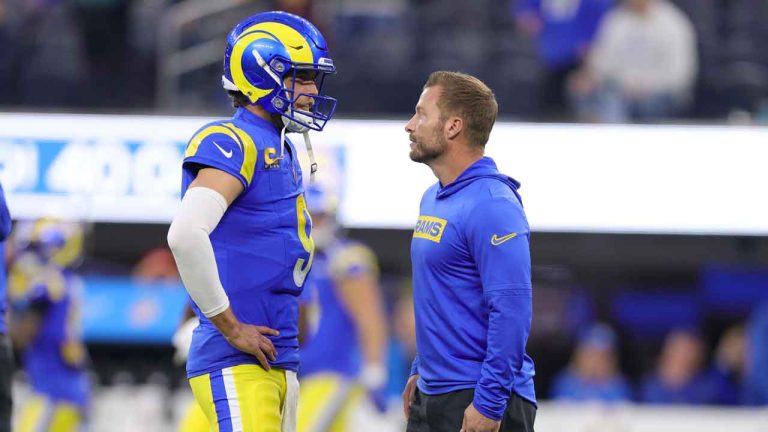 Los Angeles Rams quarterback Matthew Stafford talks to head coach Sean McVay before an NFL football game against the Arizona Cardinals. (Ryan Sun/AP)