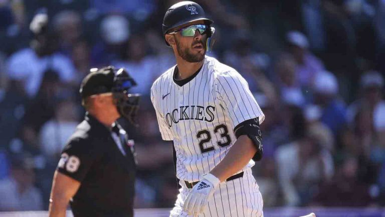 Colorado Rockies' Kris Bryant (23) heads to the dugout after striking out against Milwaukee Brewers relief pitcher Joel Payamps with the bases loaded in the eighth inning of a baseball game Thursday, April 10, 2025, in Denver. (David Zalubowski/AP)