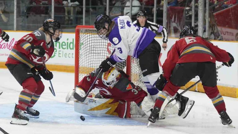 Minnesota Frost forward Brooke McQuigge (3) is stopped by Ottawa Charge goalie Gwyneth Philips (33) under pressure from Ottawa Charge defence Stephanie Markowski (6) and forward Alexa Vasko (10) during second period PWHL action, Wednesday, April 30, 2025 in Ottawa. (Adrian Wyld/CP)
