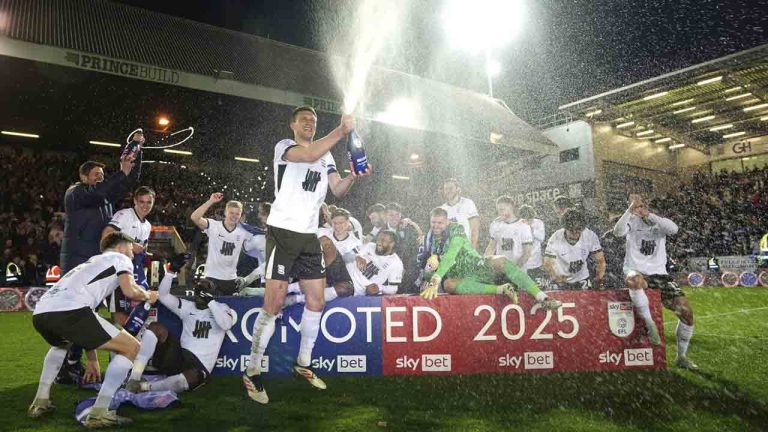 Birmingham City players celebrate promotion after the Sky Bet League One soccer match against Peterborough United at the Weston Homes Stadium, Tuesday April 8, 2025, in Peterborough, England. (Joe Giddens/PA via AP)