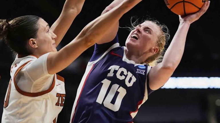 TCU guard Hailey Van Lith (10) goes to the basket against Texas guard Shay Holle during the second half in the Elite Eight of the NCAA college basketball tournament, Monday, March 31, 2025. in Birmingham, Ala. (Gerald Herbert/AP)