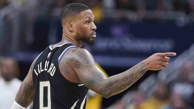 Milwaukee Bucks guard Damian Lillard (0) gestures after a three-point basket against the Indiana Pacers during the second half of a first-round NBA basketball playoff game in Indianapolis, Tuesday, April 22, 2025. (Michael Conroy/AP)