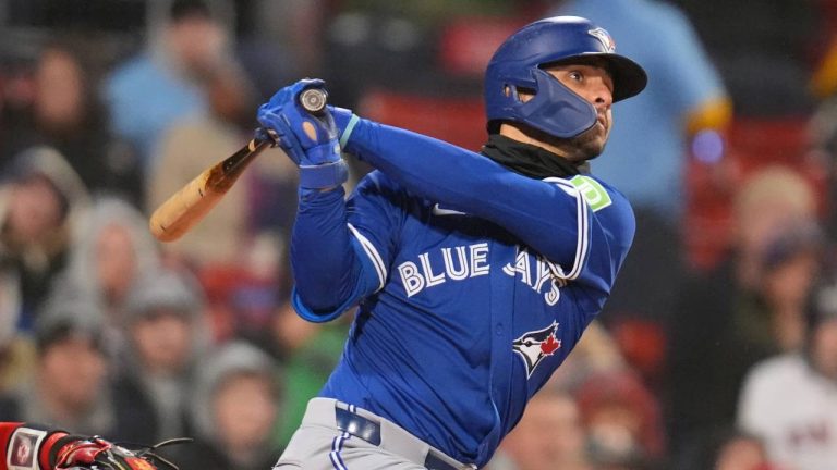 Toronto Blue Jays' Andrés Giménez watches the flight of his sacrifice fly which scored Bo Bichette during the third inning of a baseball game against the Boston Red Sox. (Charles Krupa/AP)