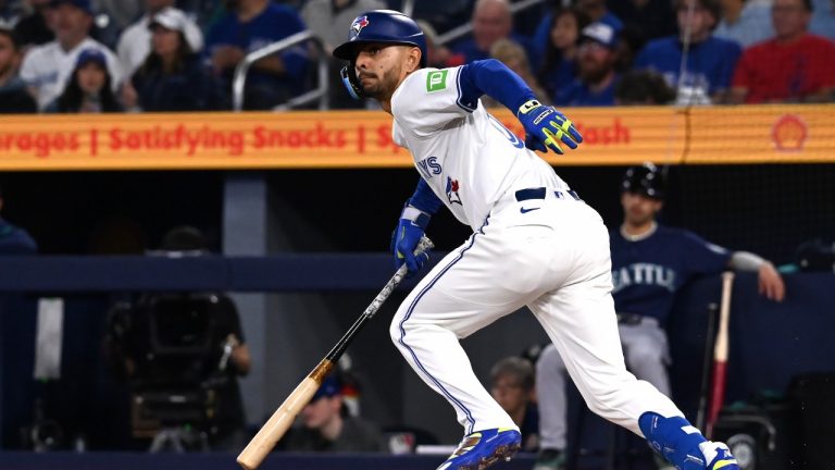 Toronto Blue Jays second baseman Andres Gimenez hits a double against the Seattle Mariners in first inning American League baseball action in Toronto on Saturday, April 19, 2025. (THE CANADIAN PRESS/Jon Blacker)