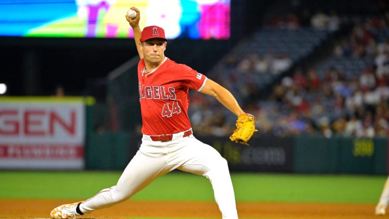 Los Angeles Angels' Ben Joyce, pitching in the eighth inning, earns a save against the Atlanta Braves in a baseball game Friday, Aug. 16, 2024, in Anaheim, Calif. (AP/Jayne Kamin-Oncea)