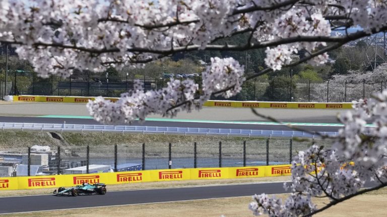 Aston Martin driver Lance Stroll of Canada steers his car near the cherry blossom during the first practice session for the Japanese Formula One Grand Prix at the Suzuka Circuit in Suzuka, central Japan, Friday, April 4, 2025. (AP Photo/Hiro Komae)