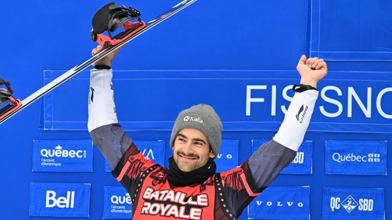 Eliot Grondin of Sainte-Marie Que., celebrates his second place finish in the final which secures the Crystal Globe for the season’s championship at the FIS Snowboard Cross World Cup event at Mont-Sainte-Anne resort in Beaupre Que.Saturday, April 5, 2025  THE CANADIAN PRESS/Jacques Boissinot