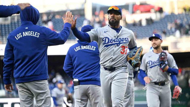 Los Angeles Dodgers outfielder Teoscar Hernández is congratulated as he and his teammates come off the field after defeating Washington Nationals Wednesday, April 9, 2025, in Washington. (John McDonnell/AP)