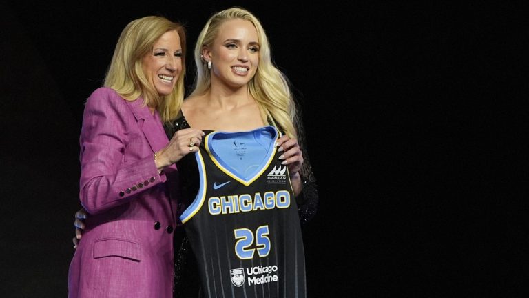 TCU's Hailey Van Lith, right, poses for a photo with WNBA commissioner Cathy Engelbert after being selected 11th overall by the Chicago Sky during the first round of the WNBA basketball draft, Monday, April 14, 2025, in New York. (AP Photo/Pamela Smith)