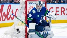 DeBrusk scores in OT, Tolopilo gets first win as Canucks down slumping Sharks