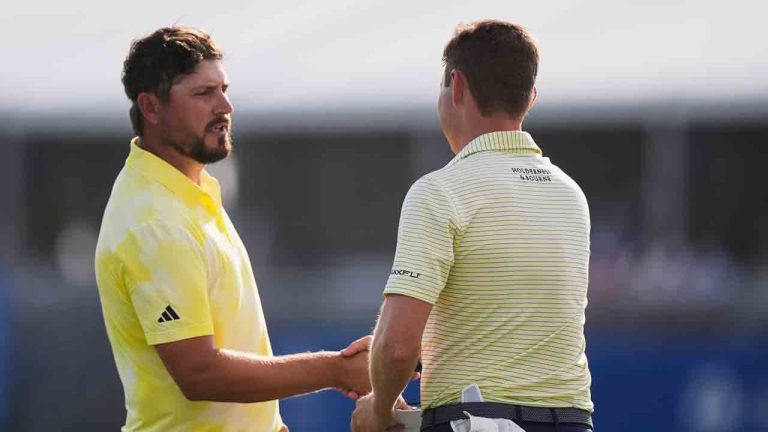 Andrew Novak, left, shakes hands with teammate Ben Griffin on the 18th green after finishing the first round of the PGA Zurich Classic golf tournament at TPC Louisiana in Avondale, La., Thursday, April 24, 2025. (Gerald Herbert/AP)