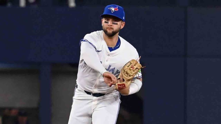 Toronto Blue Jays shortstop Bo Bichette (11) throws to first base to put out Boston Red Sox designated hitter Rafael Devers, not pictured, in first inning MLB action in Toronto on Tuesday, April 29, 2025. (Jon Blacker/CP)