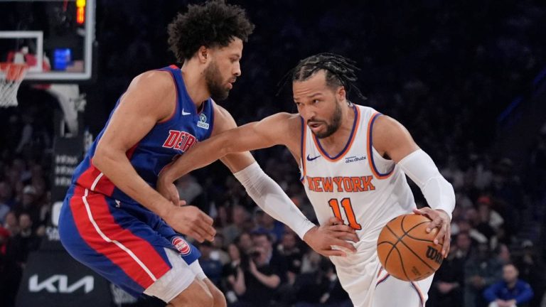 Detroit Pistons' Cade Cunningham, left, defends New York Knicks' Jalen Brunson (11) during the first half of an NBA basketball game. (Frank Franklin II/AP)