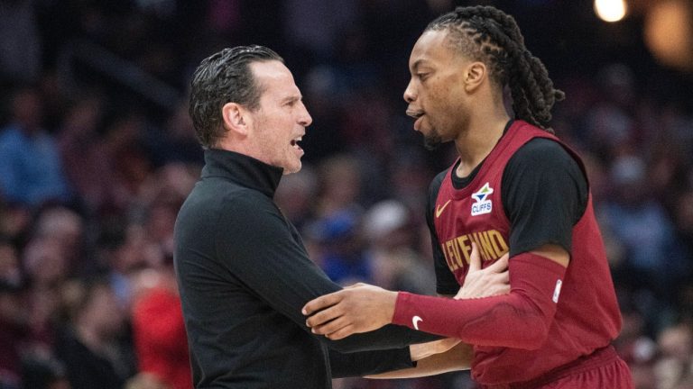 Cleveland Cavaliers head coach Kenny Atkinson, left, congratulates Darius Garland, right, after he made a three-point shot against the Chicago Bulls during the first half of an NBA basketball game in Cleveland, Tuesday, April 8, 2025. (Phil Long/AP)