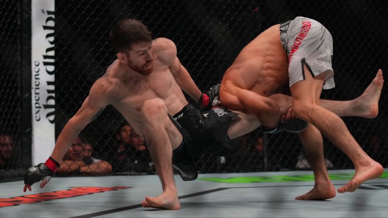 Umar Nurmagomedov, right, fights with Cory Sandhagen, left, in a bantamweight mixed martial arts bout at a UFC Fight Night in Abu Dhabi, United Arab Emirates in 2024. (Altaf Qadri/AP)