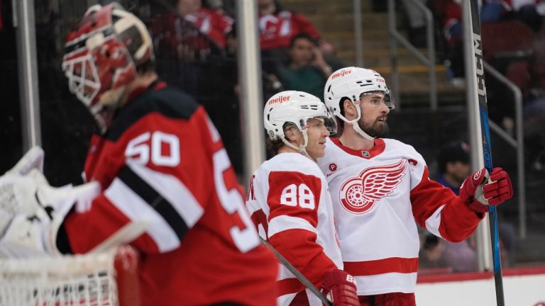 Detroit Red Wings' Dylan Larkin celebrates with Patrick Kane after scoring on New Jersey Devils goalie Nico Daws during the third period of an NHL game in Newark, N.J., Wednesday, April 16, 2025. (AP/Seth Wenig)
