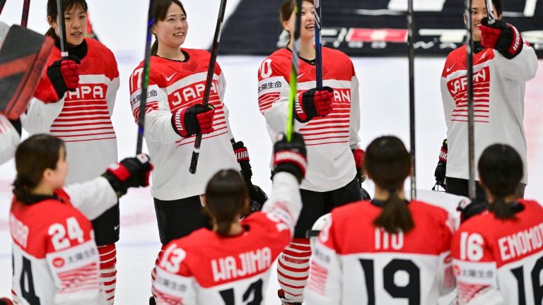 Japanese players celebrate their victory after the IIHF Women's World Championship, Group B, match between Hungary and Japan, in Ceske Budejovice, Czech Republic, Friday, April 11, 2025. (Vaclav Pancer/CTK via AP)